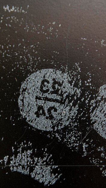Close-up album cover of Slipknot's self-titled album, showing the dark and chaotic imagery that defines their early sound. Focus on the band's logo and the gritty textures.