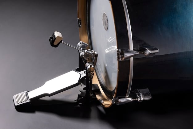A close-up shot of a high-end double bass drum pedal with adjustable settings. The focus is on the mechanisms for adjusting spring tension, beater angle, and footboard height. The image shows the precision engineering and build quality of the pedal.