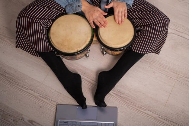 An overhead shot of a drummer's feet performing double bass drumming on pedals. The image should clearly show the heel-toe technique in action, with the drummer's ankles and feet demonstrating precise and controlled movements. The background is blurred to focus on the feet and pedals.