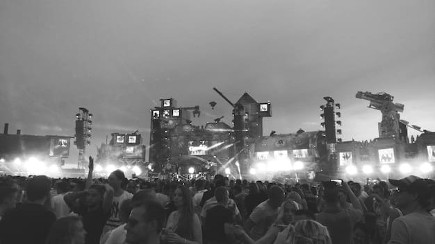 Photograph of a mosh pit at a heavy metal concert, showing diverse individuals moshing and headbanging. The image captures the intensity and energy of the pit.