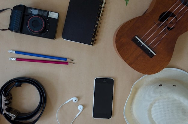 A close-up shot of essential items for staying connected at a concert, including a fully charged portable power bank, a smartphone with a concert ticket displayed, and a small carrying case for cables and accessories.