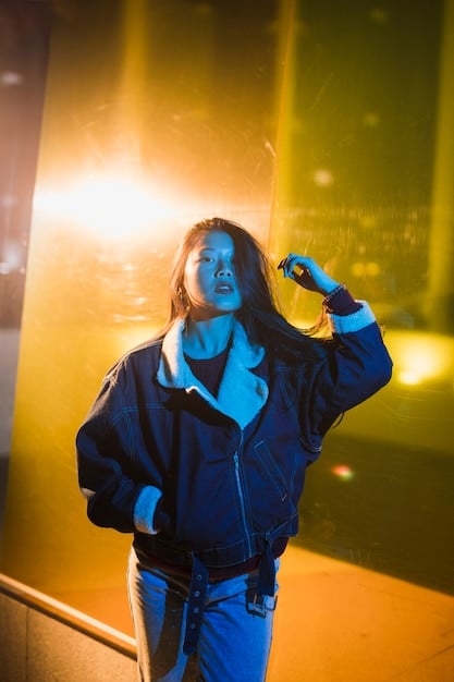 A medium shot of a person being lifted by several hands at a metal concert. The person is smiling and looking towards the stage, showing enjoyment. Bright stage lights are visible in the background.