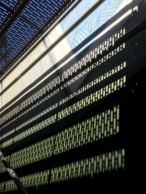 A close-up of a computer screen displaying lines of code interspersed with images of surveillance cameras. The image aims to represent the technological tools and challenges involved in digital surveillance, highlighting both the potential security benefits and the privacy risks.