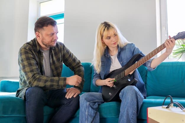 A photo showing band members arguing during a meeting, with one member looking disengaged and another visibly frustrated. The scene illustrates the lack of cohesion and communication problems that can deter record labels.