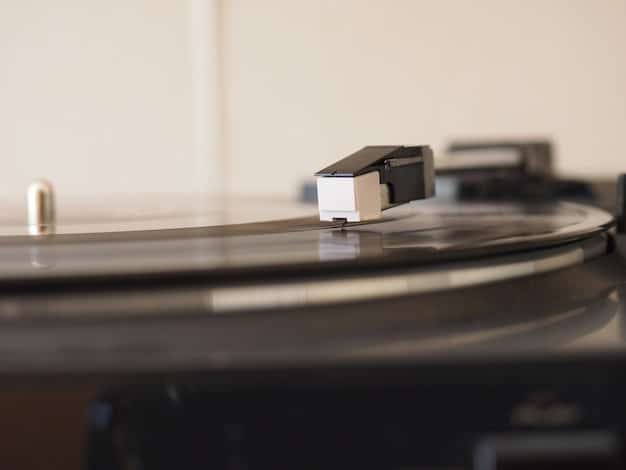 A close-up shot of a vinyl record spinning on a turntable. The needle is visible, and the background is slightly blurred, conveying a sense of nostalgia and authenticity.