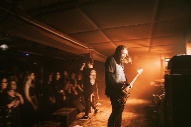 A band performing on stage, with the lead singer gesturing emphatically to the crowd while maintaining direct eye contact with individual fans. The other band members are energetically moving with the music, using their body language to connect with the audience and convey excitement.