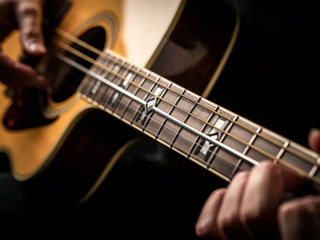 Close-up of advanced acoustic guitar fretboard with innovative materials and ergonomic neck design.