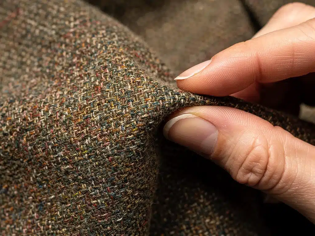Close-up of durable 1950s vintage dress fabric, showcasing tight weave and quality.