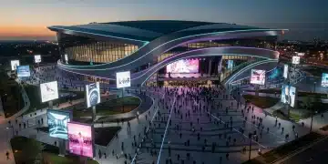 Modern US concert venue exterior with glowing lights and fan crowds