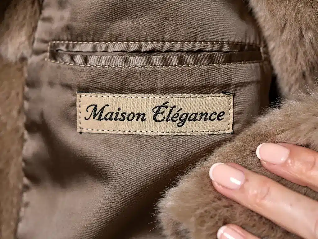 Detail of vintage fur coat lining with designer label and quality stitching